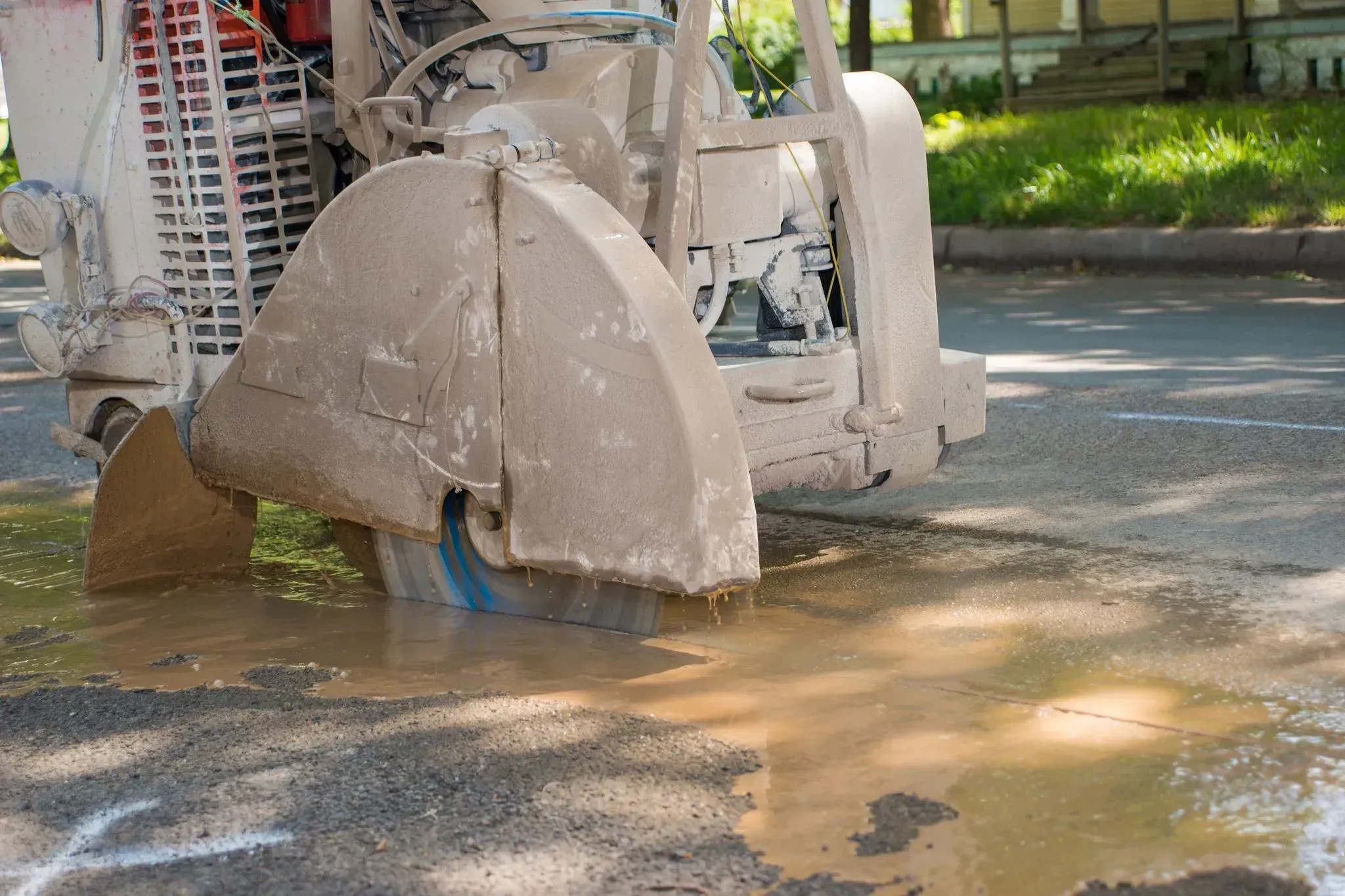 Zenesis V-Series | 15mm Segment General Purpose Concrete Blade 8 Zenesis V-Series diamond blade cutting concrete on jobsite with walk-behind saw